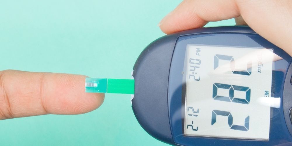 Diabetic patient measuring glucose glucometer